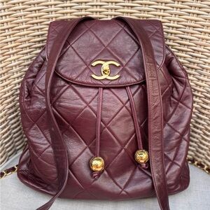 Authentic CHANEL burgundy lambskin quilted tassel 24k gold hardware backpack